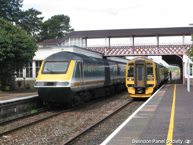 An HST in Kemble Down Platform passes a 158 in the Up Platform.