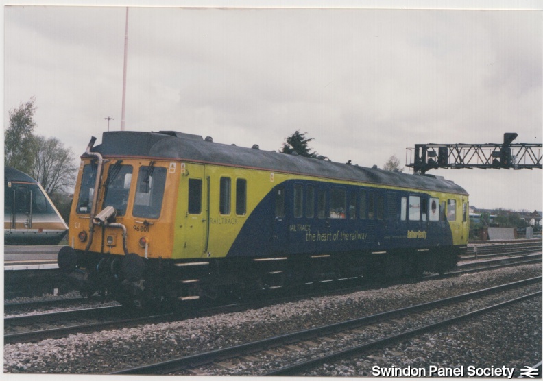Railtrack Bubblecar 96011 waits on the Up Main at Swindon (probably to follow the HST in platform 1)