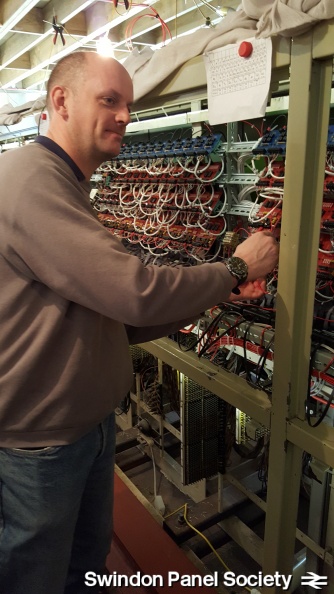 Paul adds in new power jumper cables between the circuit boards, having crimped the ends
