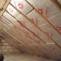Here's the result - all the insulation is completed, with one of the father & son team posing proudly by their efforts. 