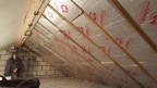 Here's the result - all the insulation is completed, with one of the father & son team posing proudly by their efforts. 