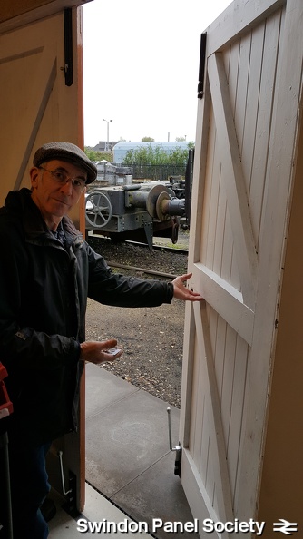 GWS Civil Engineering Manager demonstrates the fully fitted-out double doors, set of keys in hand!