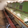 A view from the front this time; the cables running from the panel belie the works unfolding at the back desk...