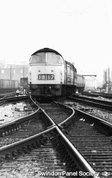 An unknown Class 52 "Western" arrives at Swindon with an express in November 1968.